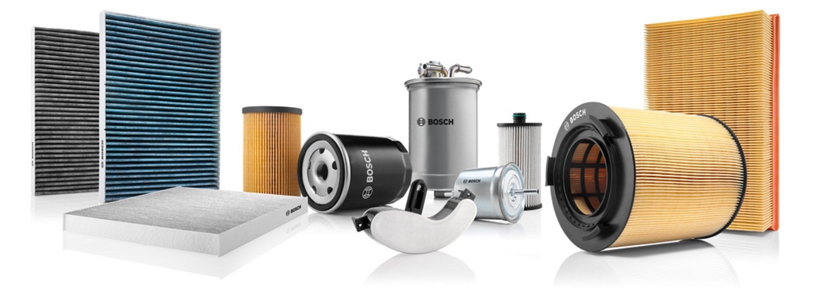 Various automotive filters including oil, air, fuel, cabin air, and diesel filters, displayed together